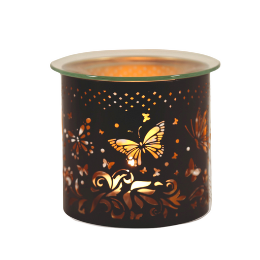 Decorative butterfly-themed candle holder with intricate cut-out design, illuminated from within, creating a warm and inviting glow—perfect for enhancing home decor and creating a cosy atmosphere.