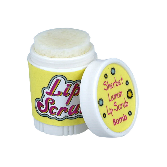 Lip care product in a container featuring a twist-off cap. The container is predominantly yellow with the words "Lip Scrub" in bold, colorful lettering on the front. The cap is slightly open, revealing a pale yellow lip scrub inside. Next to it, a smaller lid displays the text "Sherbet Lemon Lip Scrub Bomb" along with a floral design. The overall design suggests a playful and soothing lip care product.