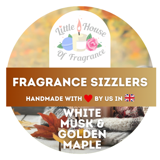 Label for 'Fragrance Sizzlers' white musk and golden maple scent, highlighting handmade quality with a UK flag, surrounded by autumn leaves and cosy blankets.